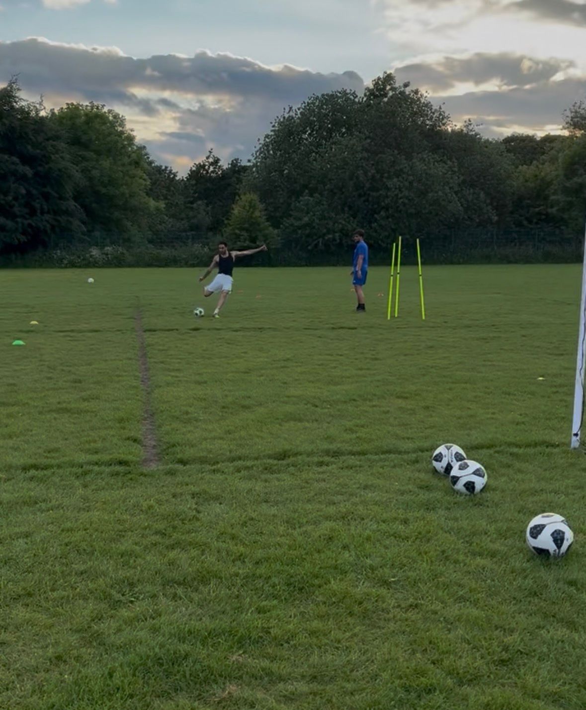 Player striking the ball during an evening session.